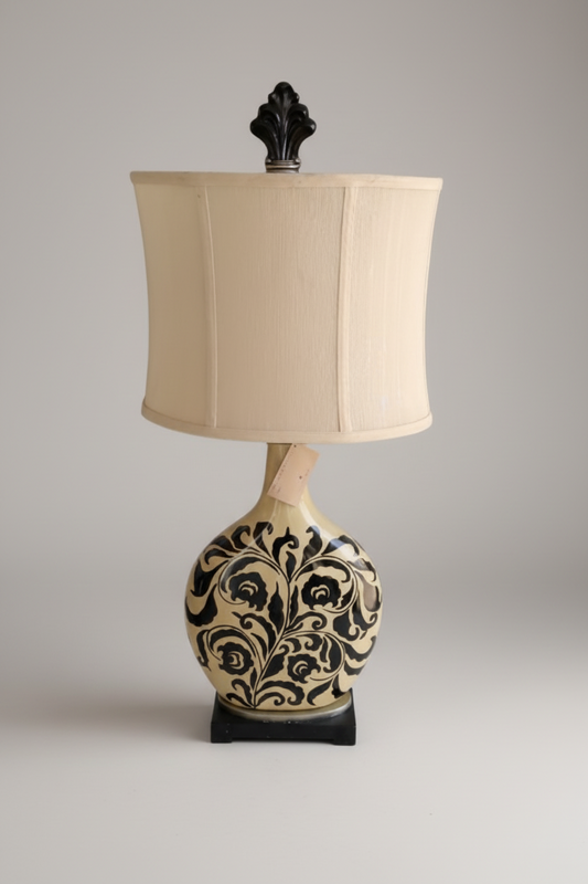 Arlumina black floral lamp, ceramic ginger jar base with hand-painted vine motifs, and a cream shade styled in a cozy living room.